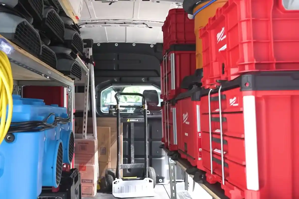 Inside an Islip Water Damage Pros service van stocked with air movers, dehumidifiers, and extraction equipment
